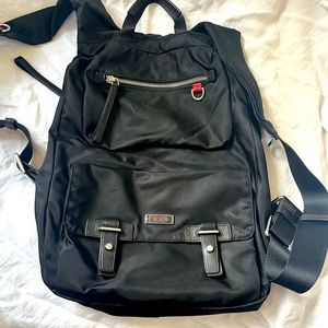 Sleek Tumi backpack.